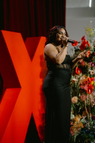 speaker on stage singing